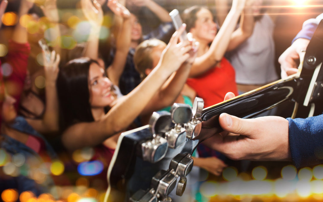 close up of people at music concert in night club