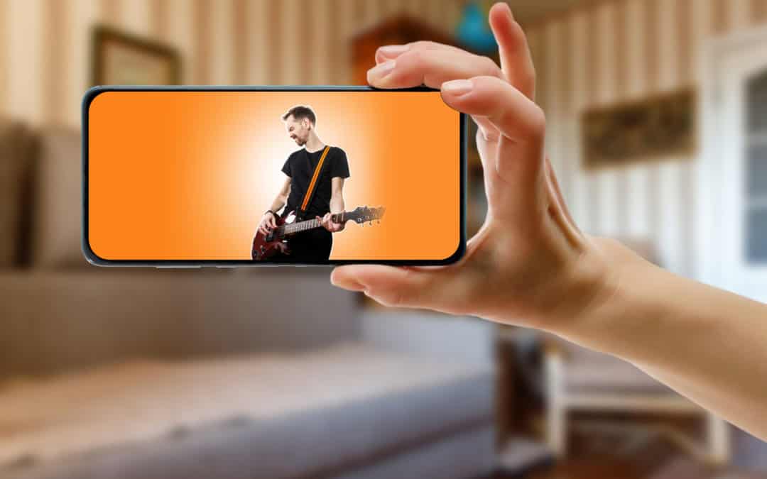 Watching online music performance by the singer at home by smartphone.