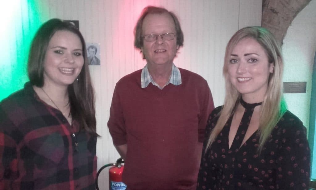 Donal Coghlan with two women discussing the independent music scene at Musibiz.