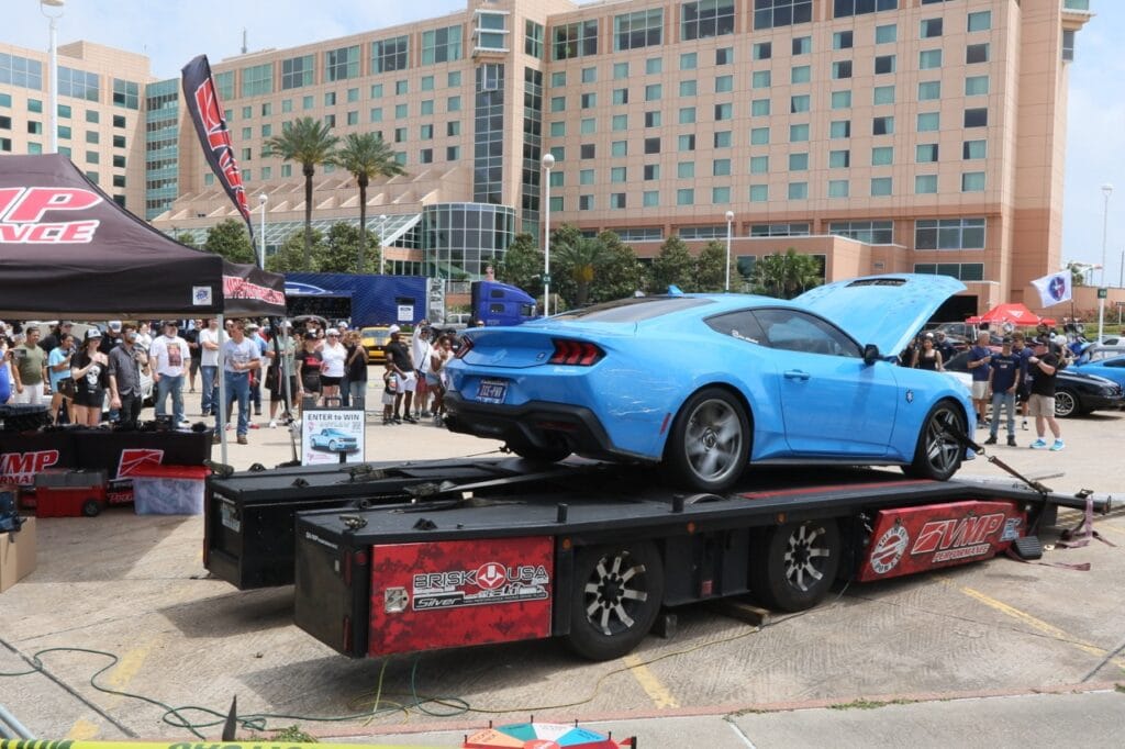 Blue Ford Mustang on dyno at Mustang Week Charlotte 2026 event.