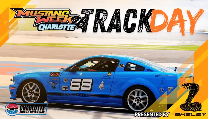 Blue race car with number 58 at Mustang Week Charlotte event.