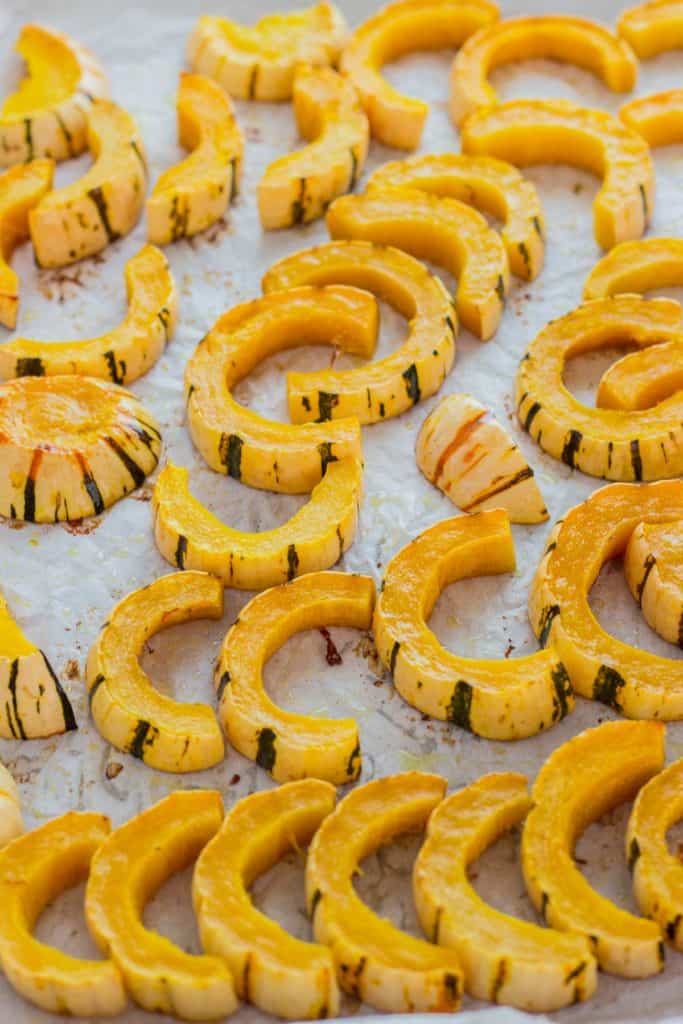 Baked delicata squash on the baking sheet