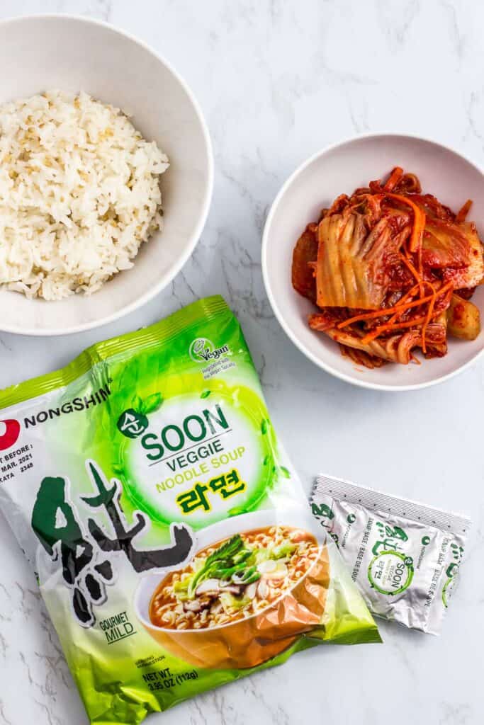 Ingredients to make the fried rice - rice, vegan kimchi and vegan Korean ramen