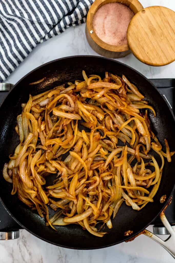 Fully caramelized onions in a skillet with deep golden brown color, ready to use