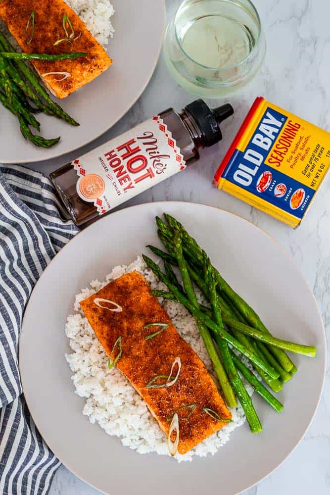 glazed salmon fillet over rice with roasted asparagus, served with Old Bay seasoning and Mike's hot honey