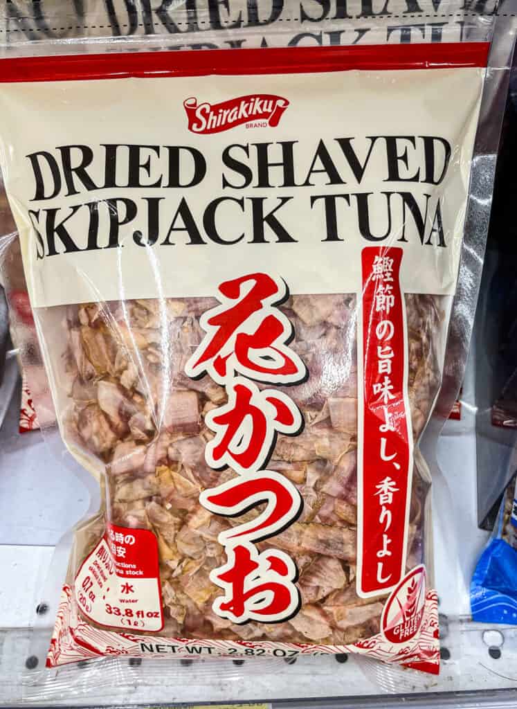 Close-up of Shirakiku brand dried shaved skipjack tuna (katsuobushi) used for making dashi stock in Japanese cooking.