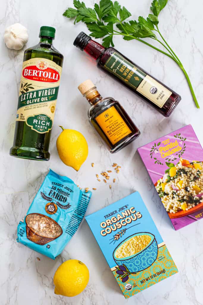 Mediterranean pantry staples with farro, couscous, pearl couscous, red wine vinegar, balsamic vinegar, olive oil, and fresh parsley
