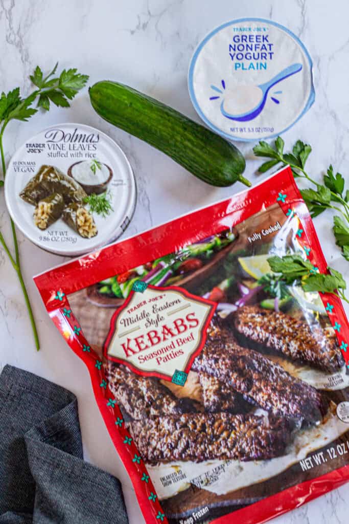 Trader Joe’s beef kebabs, dolmas, Greek yogurt, and a cucumber with parsley for a semi-homemade dinner with zucchini couscous