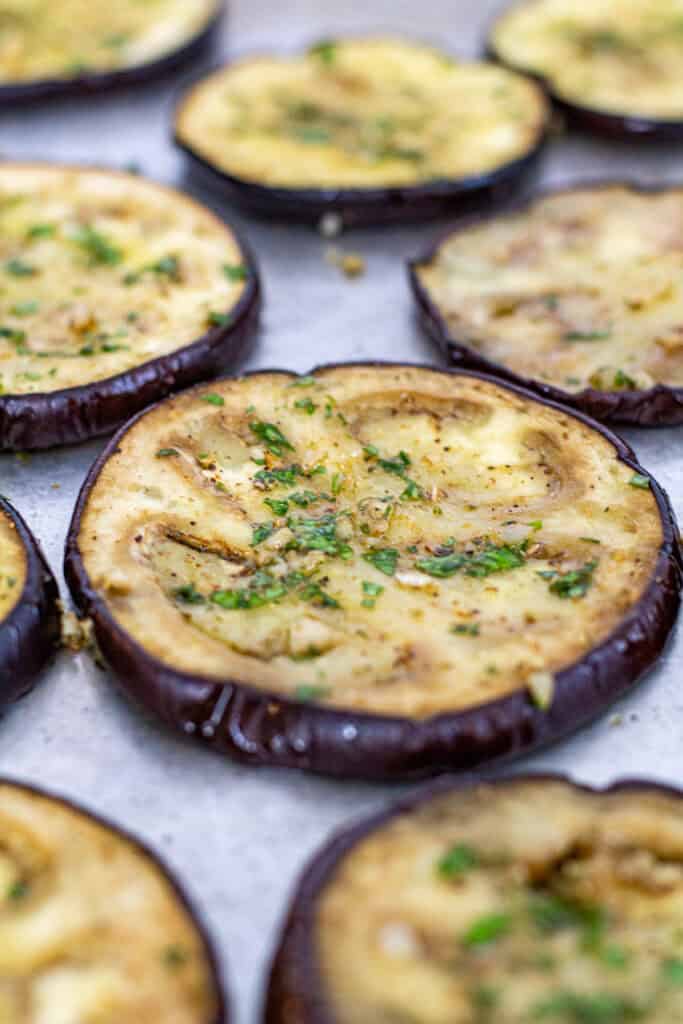 Roasted eggplant slices seasoned with herbs and olive oil for Mediterranean sandwich