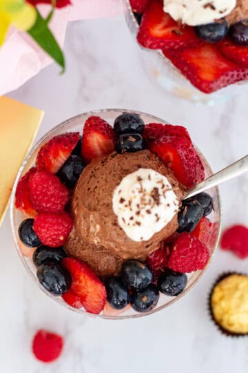 Chocolate mousse served with fresh berries in a dessert glass