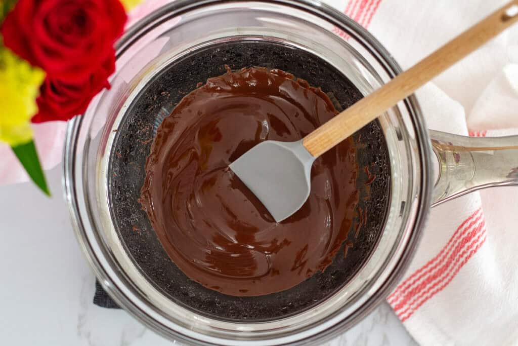 Dark chocolate gently melted in a double boiler until smooth and glossy