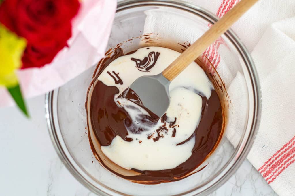 Melted vanilla ice cream poured into warm melted chocolate to create a smooth base