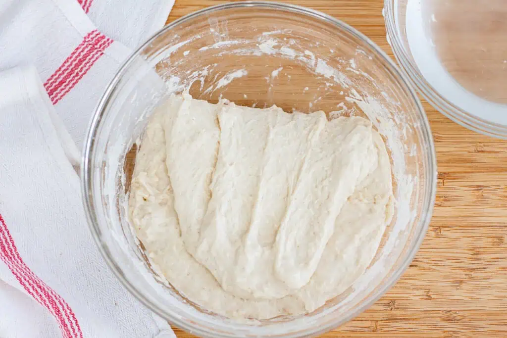 High-hydration sourdough focaccia dough after first stretch and fold in bowl