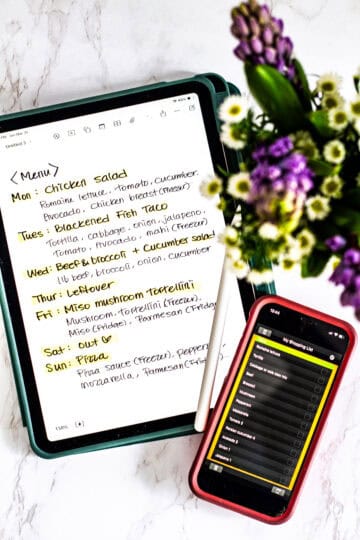Weekly meal planning for two on a tablet with a grocery list on phone showing a flexible system for planning balanced meals