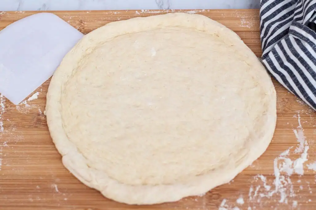 Shaped sourdough discard pizza dough ready for toppings