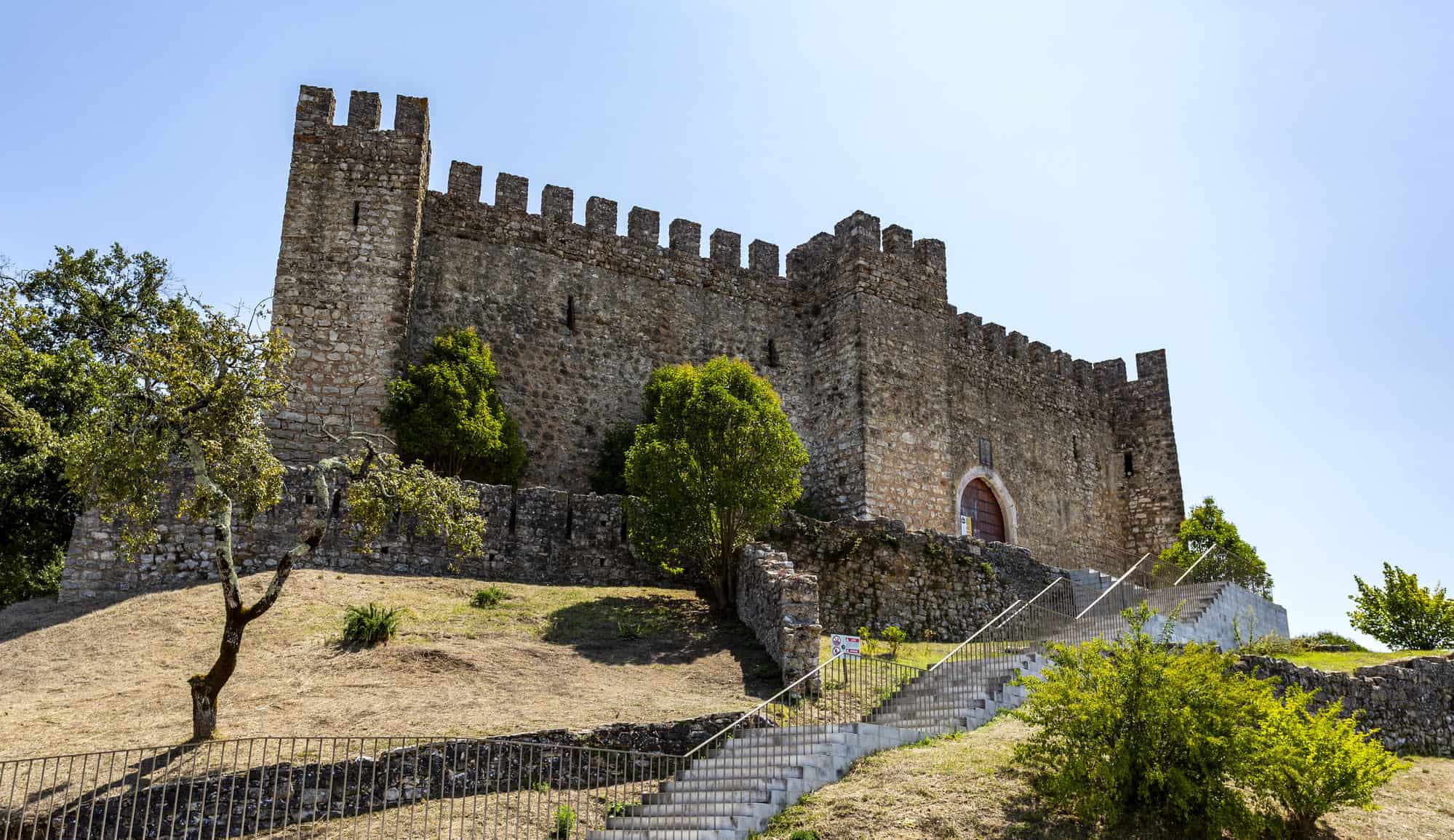 View of the hilltop medieval Castle of Pombal, built in the 12th century and donated to the Knights Templar in order to defend Coimbra, Central Portugal