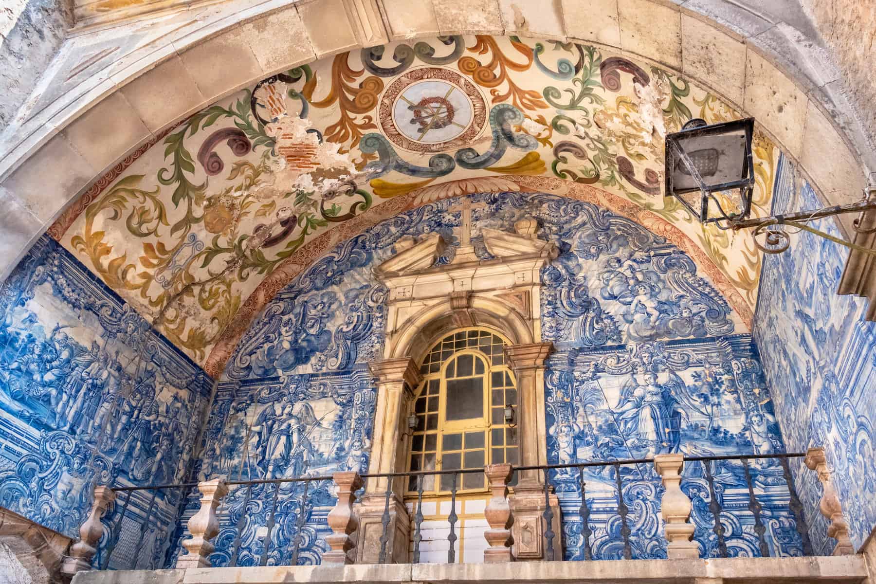 View to Azulejo and decorated ceiling of Porta da Vila the main entrance to medieval Obidos, Portugal