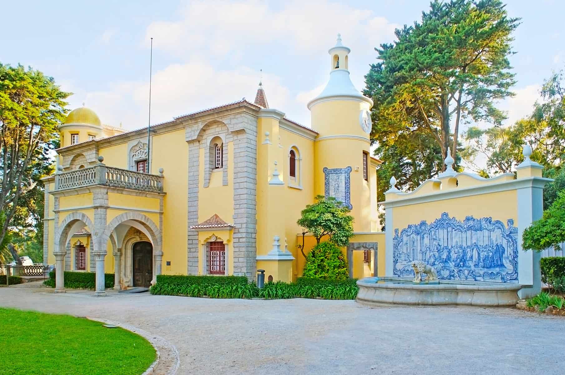 CASCAIS, PORTUGAL - MAY 1, 2012: The facade of Palace-Museum of Condes de Castro Guimaraes with the small towers, pictures of blue tile and the fountain with sone lion Cascais.