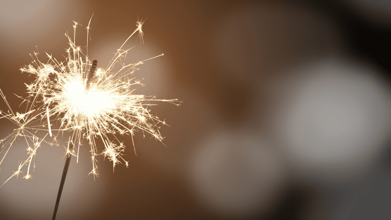 Sparkler celebrating at NLW International event, symbolizing joy and unity in worship.
