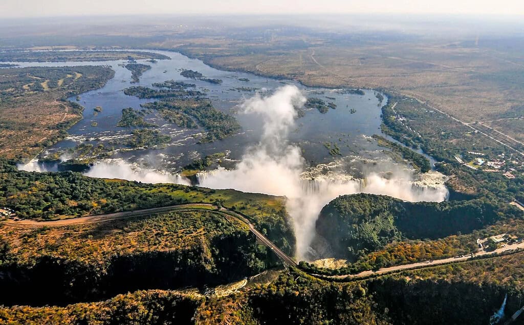 Stunning aerial image of Niagara Falls showcasing the majestic waterfalls and lush green surroundings.
