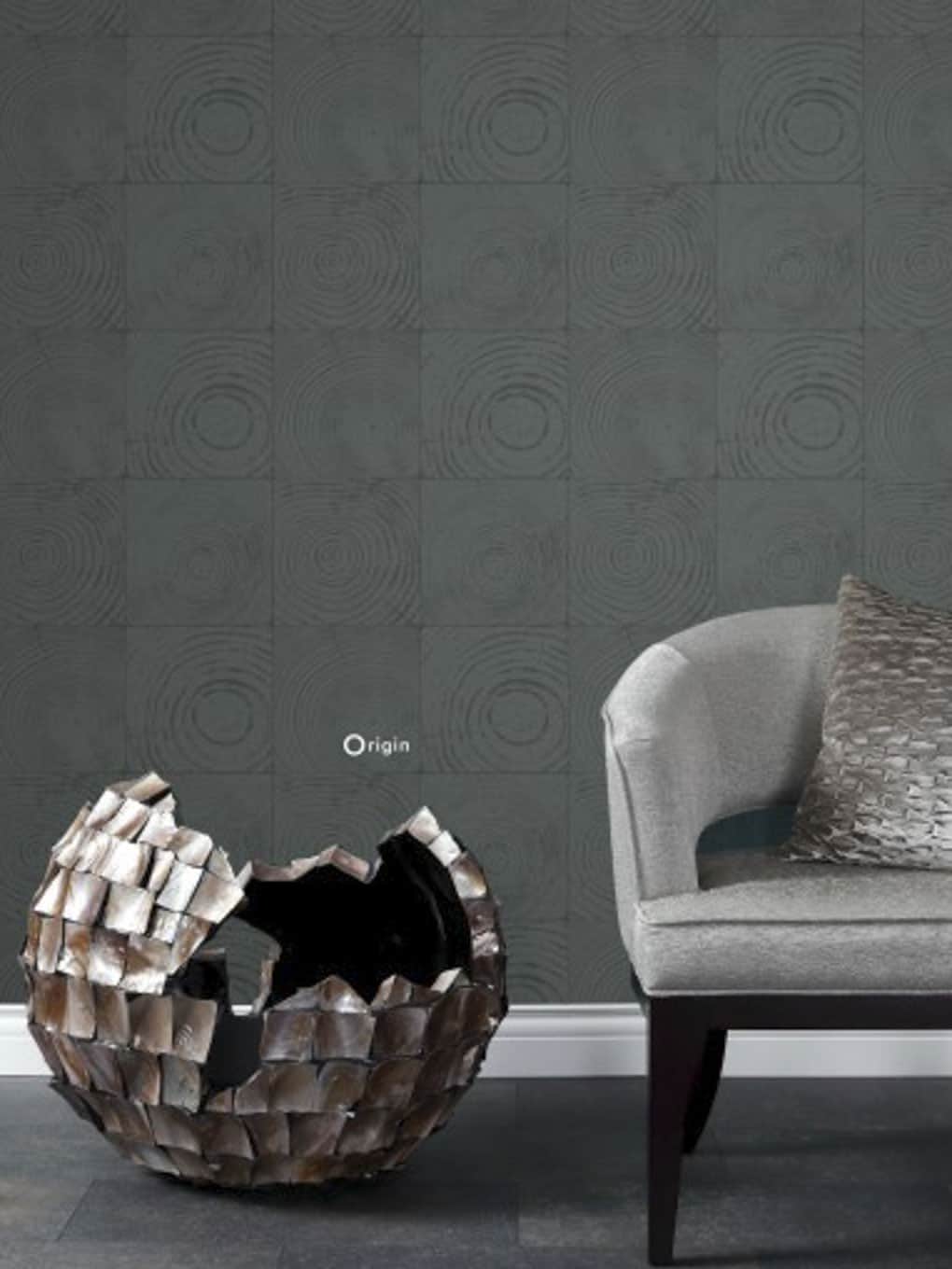 Contemporary living room with textured wall tiles and unique decorative bowl.