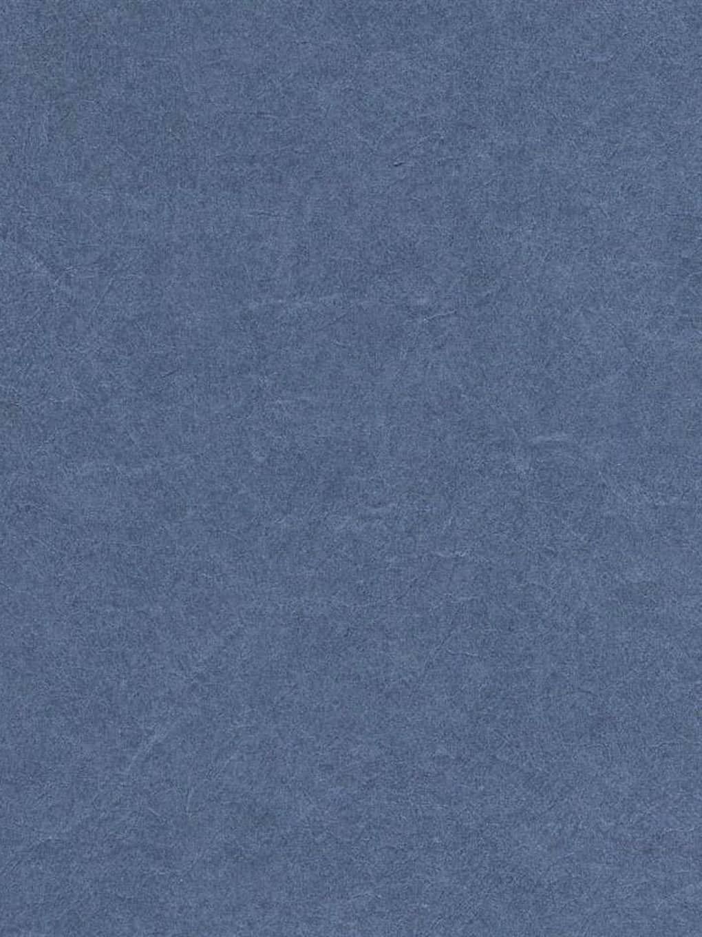 Blue textured wall surface for interior decor and design.