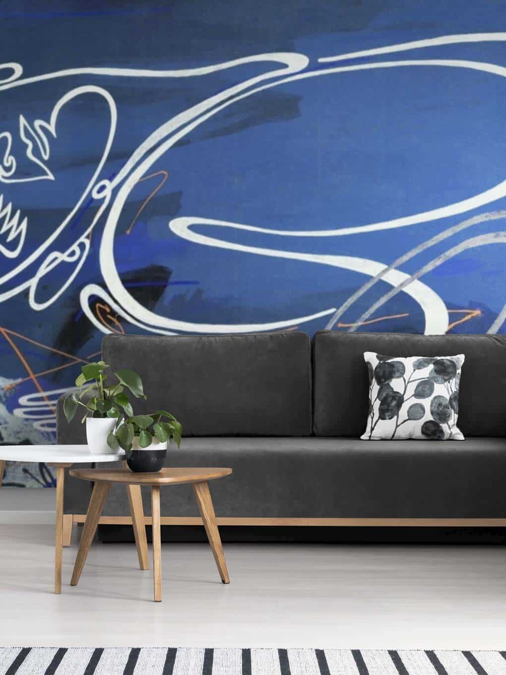 Abstract wall art with white swirling lines on a blue background, perfect for contemporary interior.
