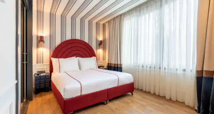 Elegant hotel room at KHAI HOTEL KARAKÖY with contemporary design and cozy ambiance.