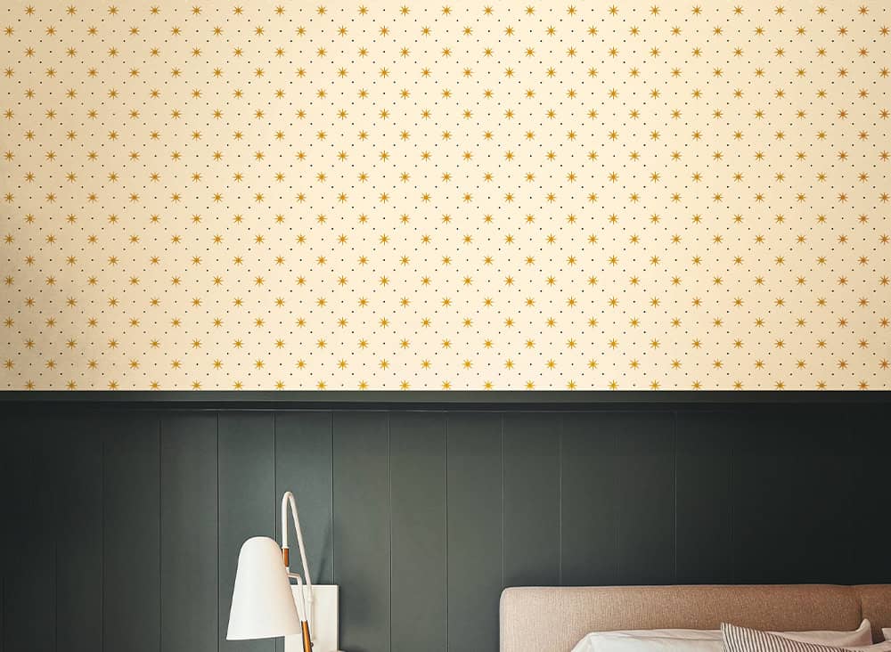 Elegant bedroom decor with star-patterned wallpaper and modern furnishings.