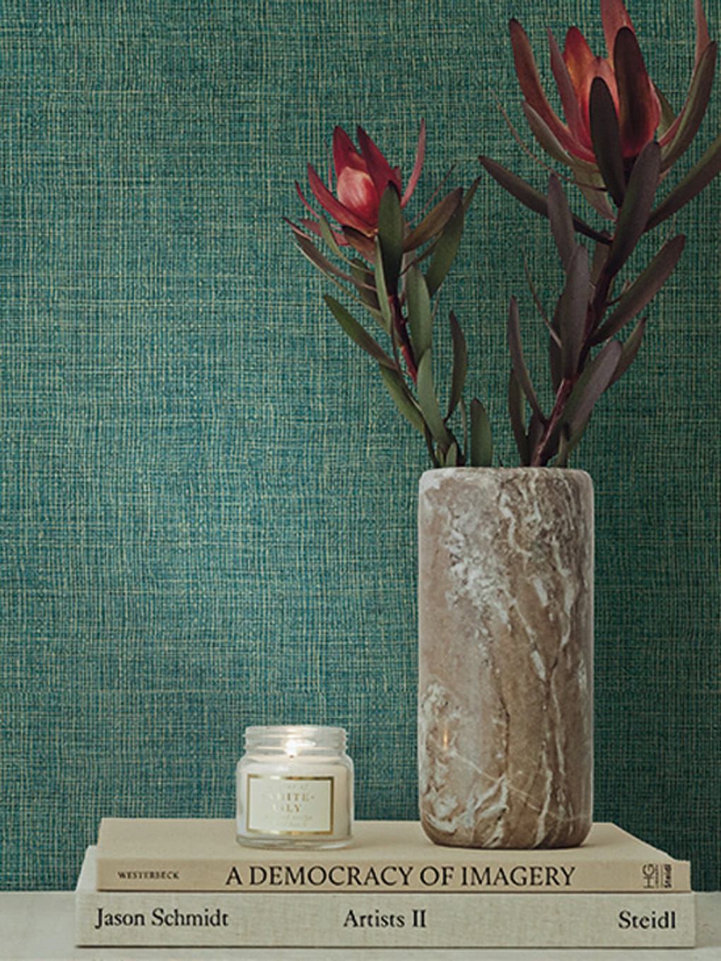Elegant floral decor with red flowers in a marble vase, perfect for enhancing contemporary interior.