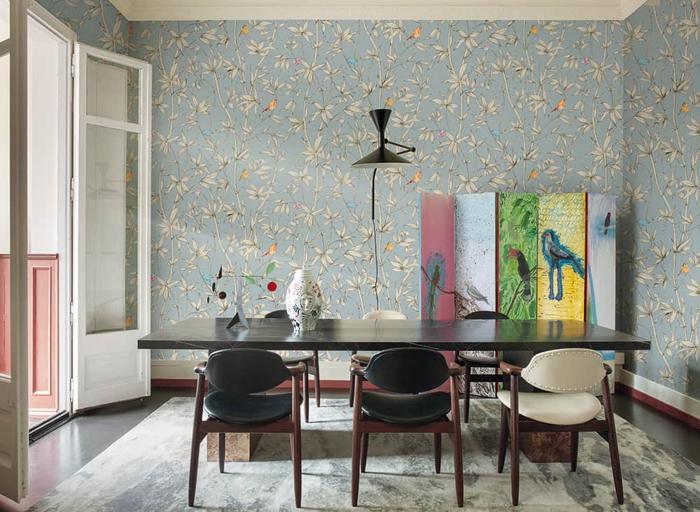 Elegant floral wallpaper enhances the dining space with a vibrant, nature-inspired design.