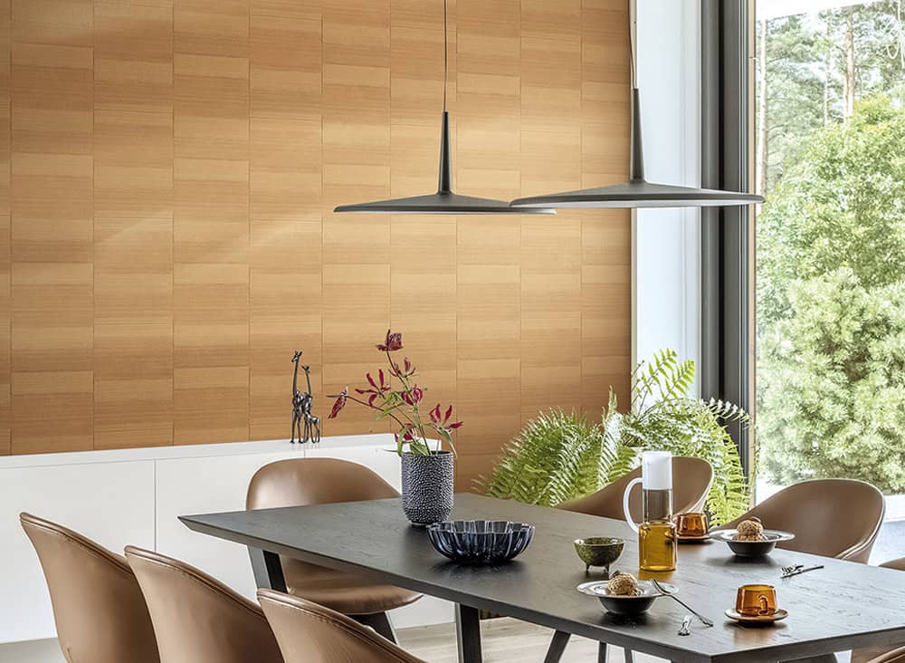 Modern dining room with wooden wall, large window, and stylish table setting.