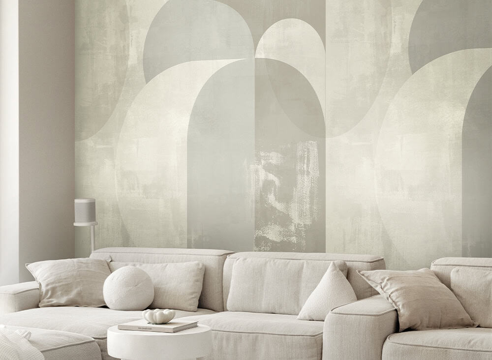 Modern living room with abstract wall art and neutral-toned sofa.