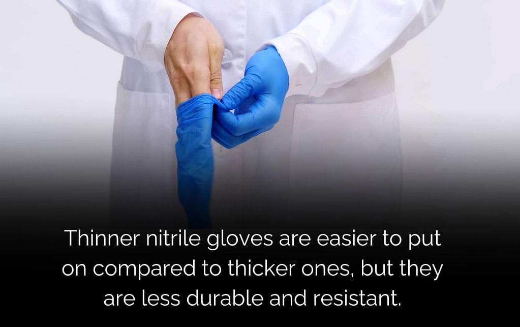Person putting on blue nitrile gloves. Finding the right glove thickness is key.