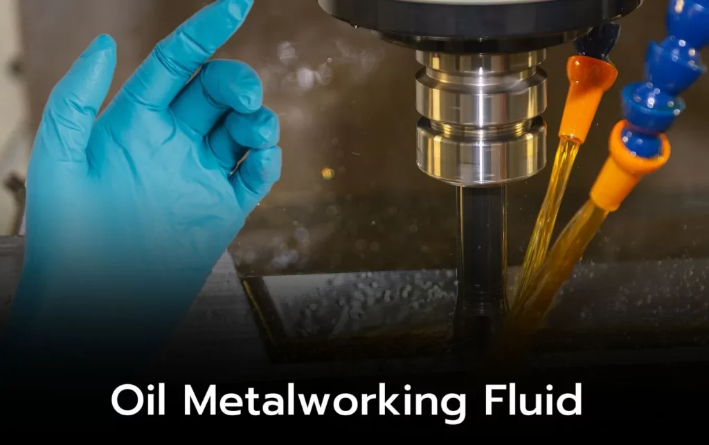 Close-up of oil metalworking fluid spraying onto a nitrile glove during machining.