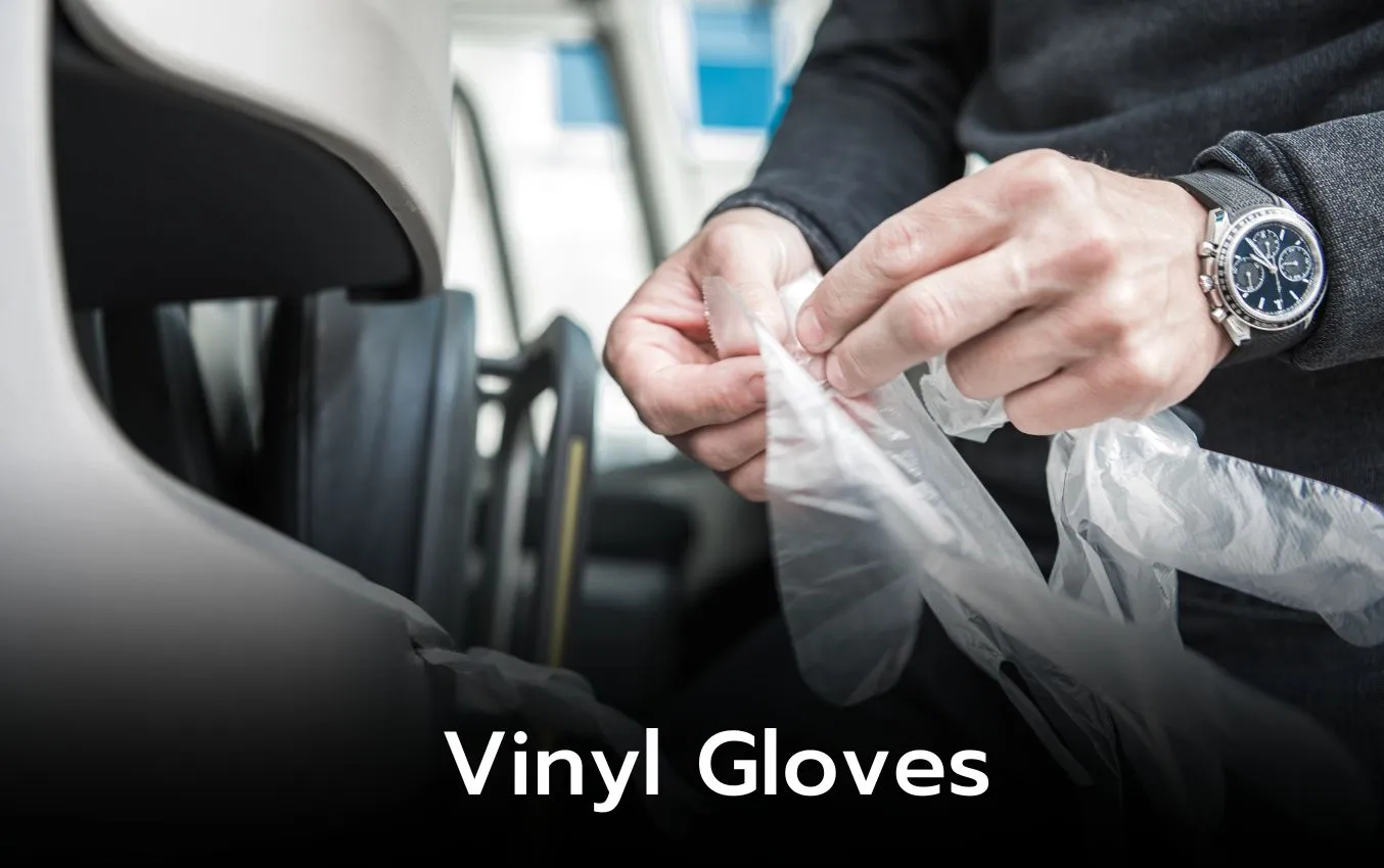 Person putting on vinyl gloves. Latex-free disposable gloves.
