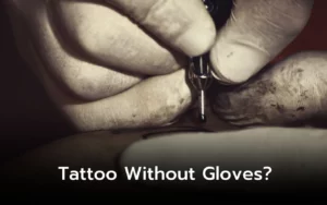 Close-up of tattooed hands wearing gloves, tattoo machine in use. Tattoo without gloves?
