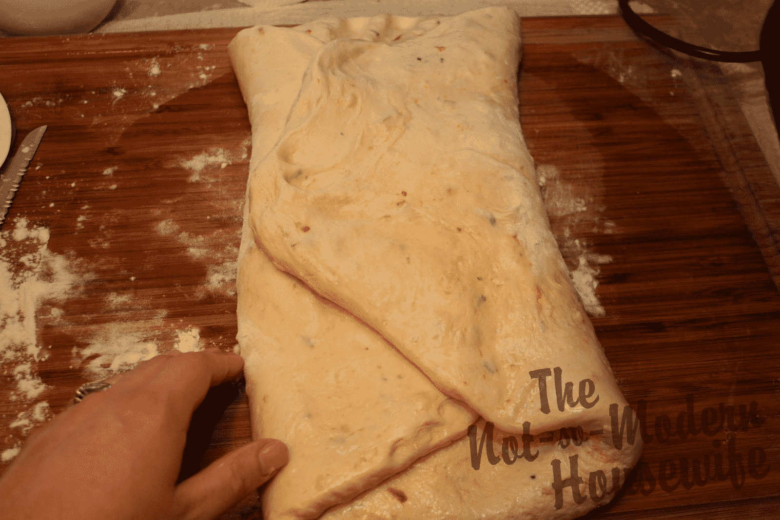 Italian Sun-dried Tomato Ciabatta | The Not so Modern Housewife folding bread dough