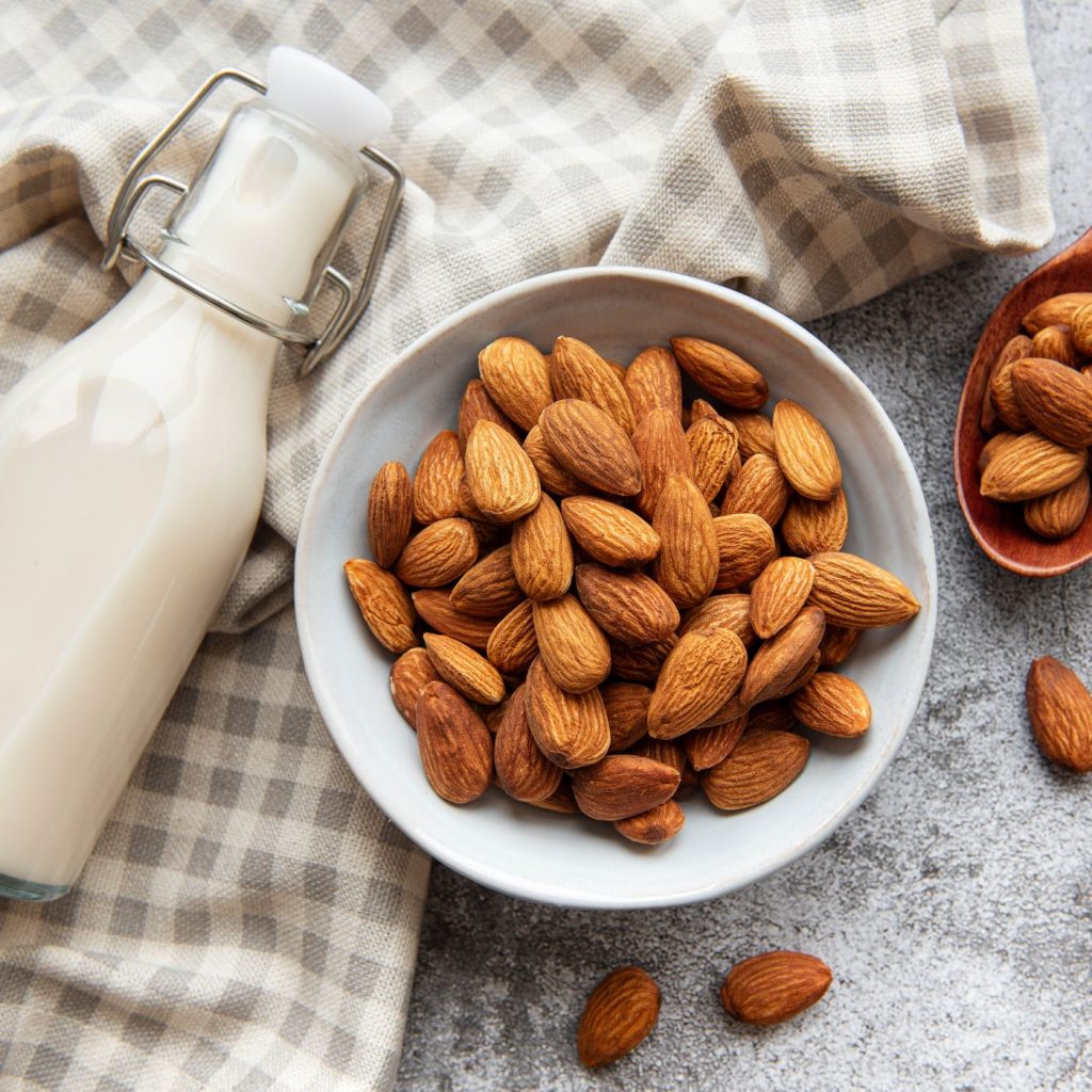 Risgrynsgröt: The Perfect Recipe for Swedish Rice Porridge | The Not so Modern Housewife Milk with a bowl of almonds for rice pudding