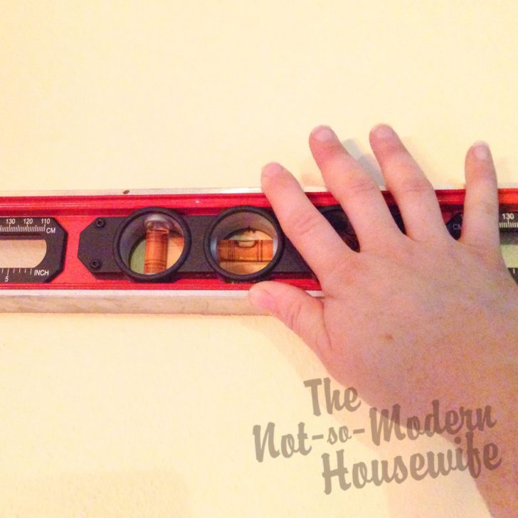 Transform Your Textured Walls with Custom Vinyl Lettering: A Step-by-Step Guide! | The Not so Modern Housewife Use level to mark walls for wall lettering