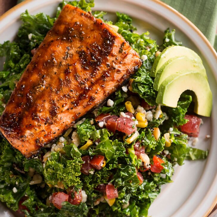 Understanding and Managing Estrogen Dominance Naturally | The Not so Modern Housewife glazed salmon on a bed of greens with avocado - eat health fats to improve symptoms of estrogen dominance