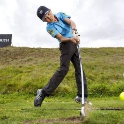 Golf swing exercise at New Plymouth Golf Club to improve flexibility and performance.