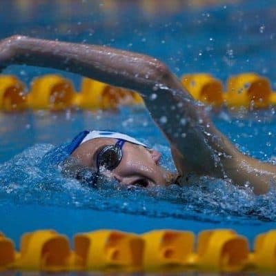 Swimmer performing water therapy in a swimming pool at New Plymouth Physiotherapy.