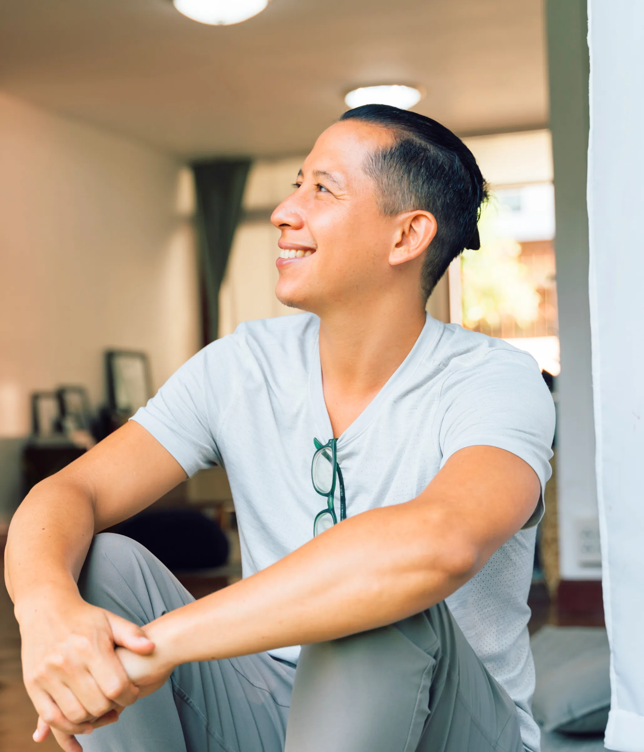 Man smiling and staring into the distance