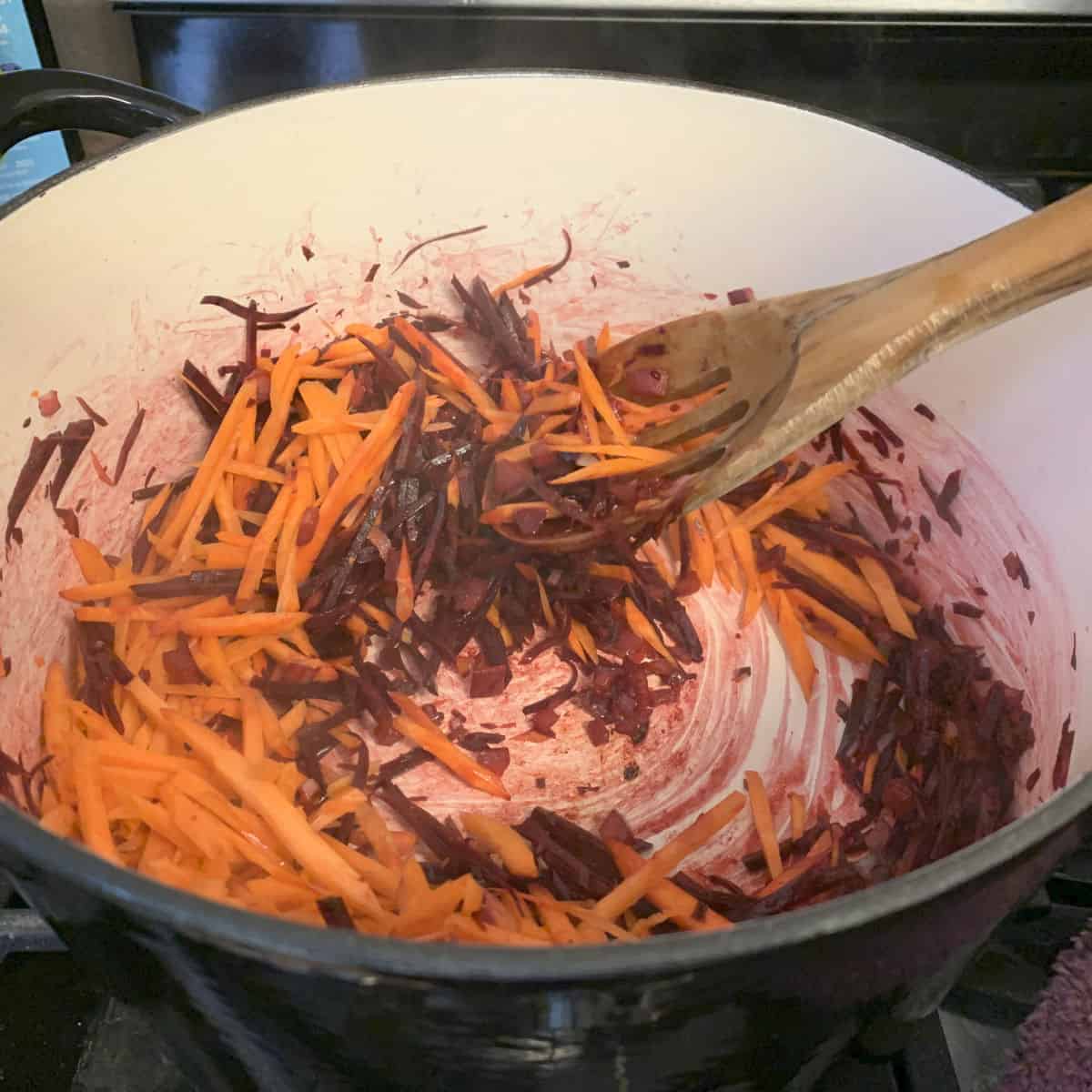 Sautéing the carrots in a dutch oven.