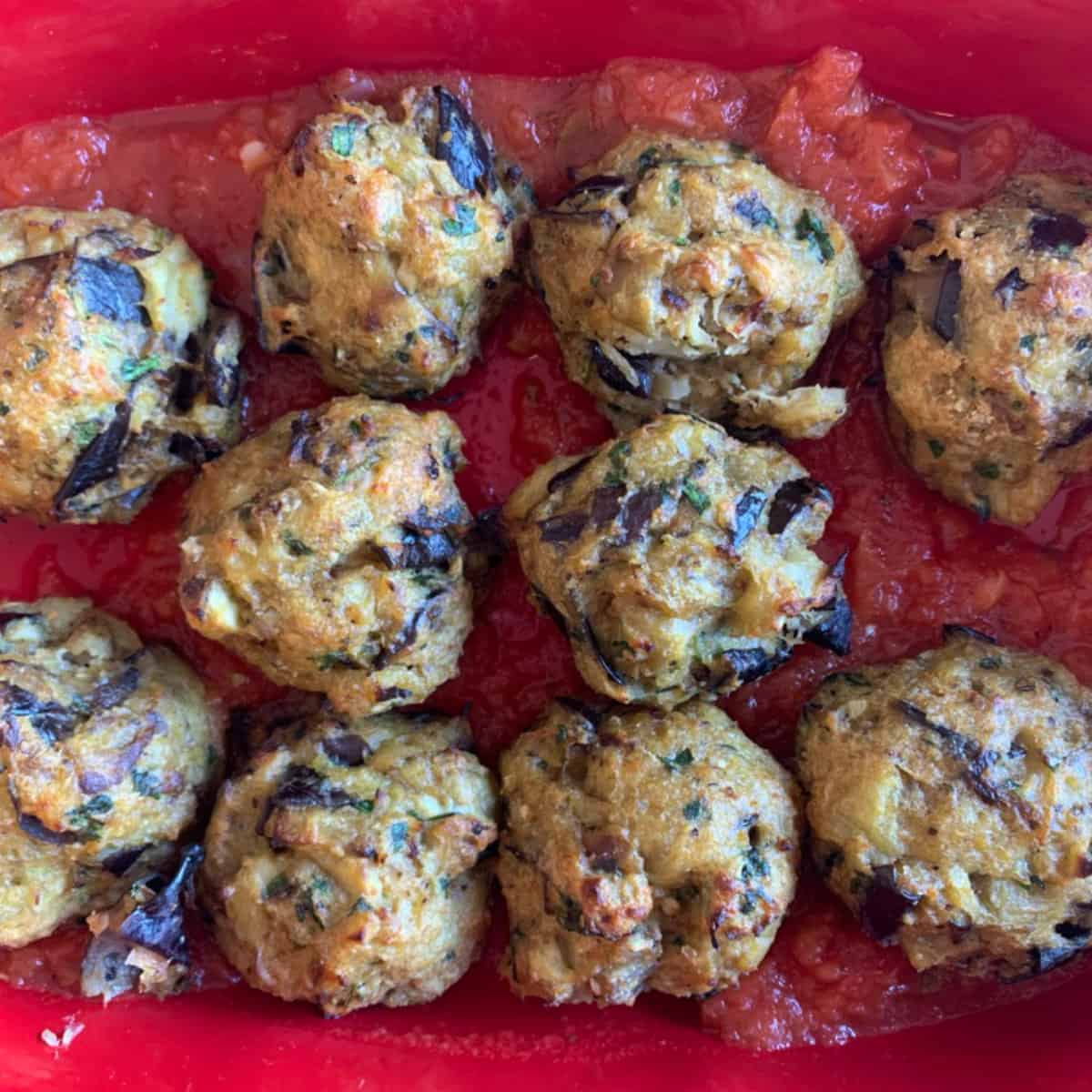 Ready eggplants in a red sauce.