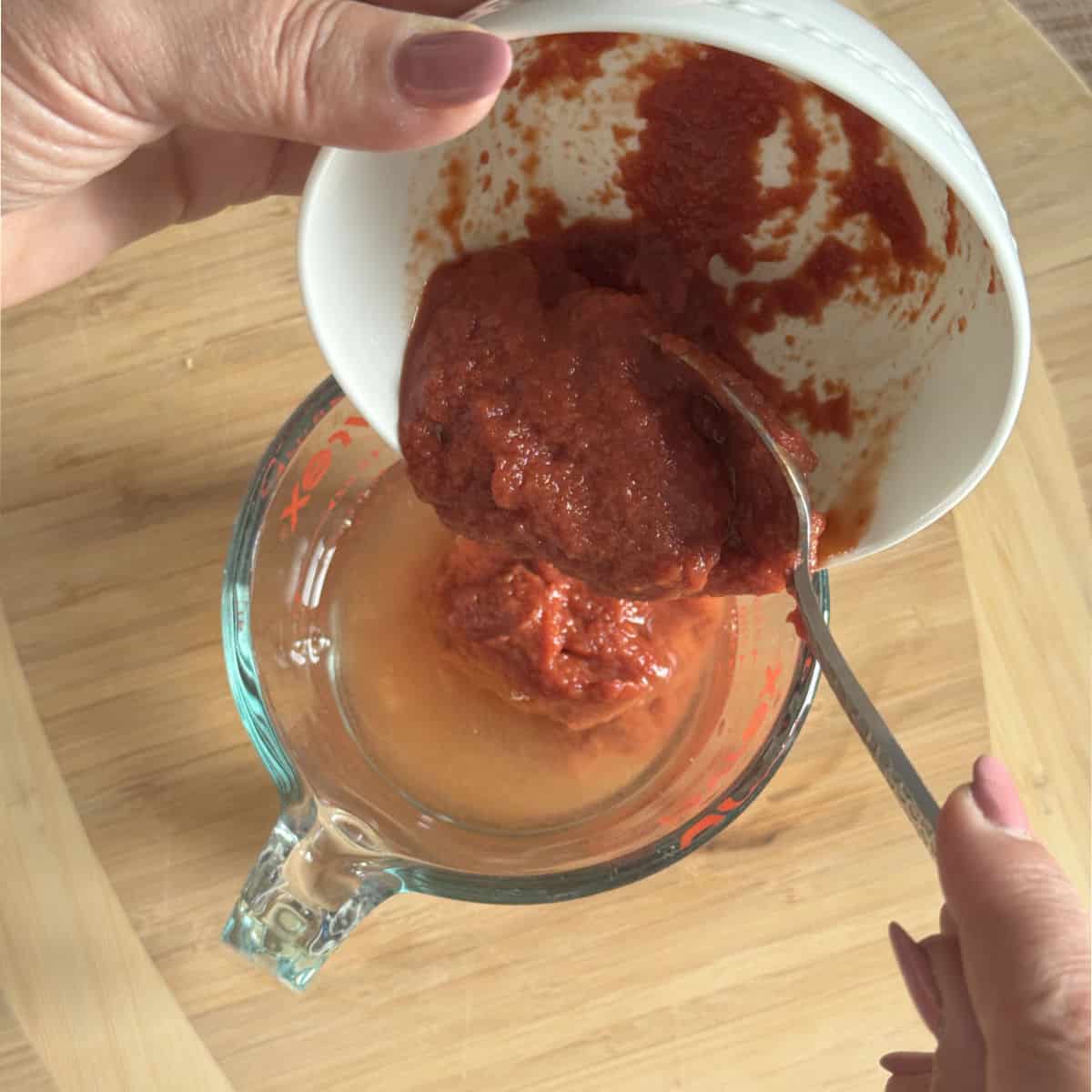 Diluting tomato paste in a water.