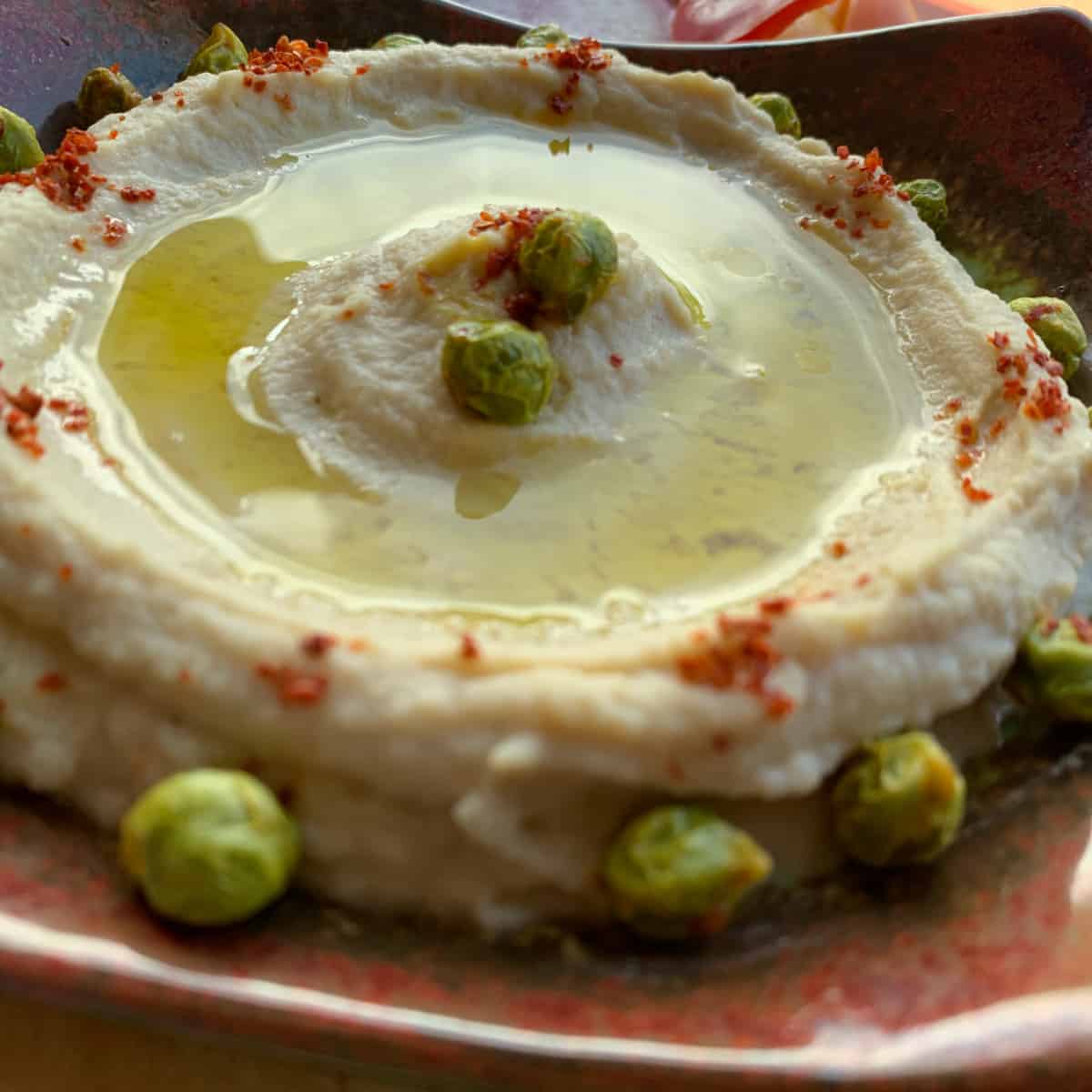 Hummus dip with fresh chickpeas.