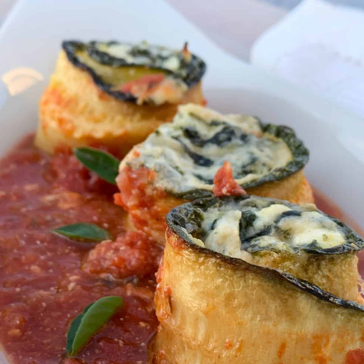 Zucchini rollatini in a tomato sauce.