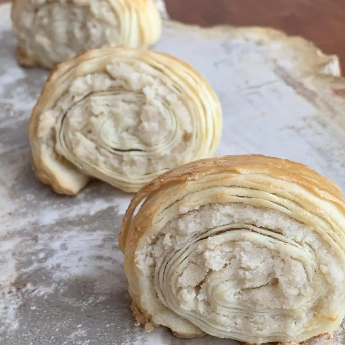 Three gata on a marble board.